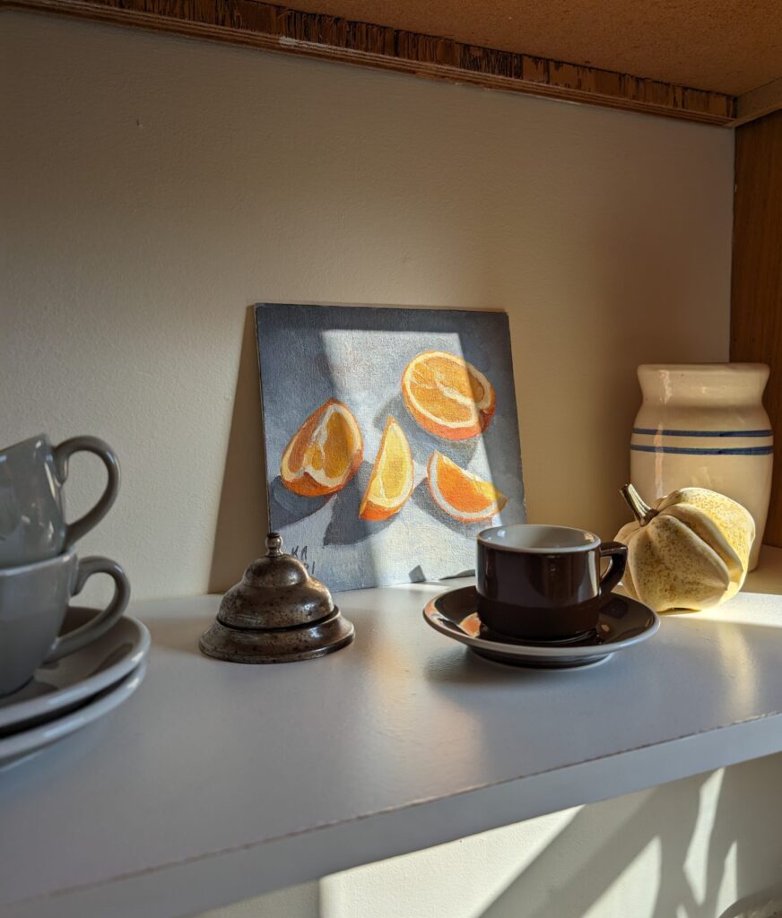 porcelain coffee cups on a shelf