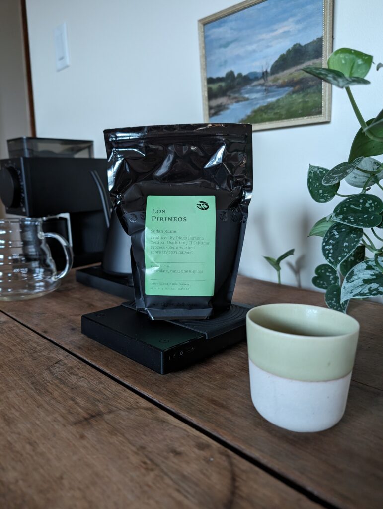 Los Pirineos coffee bag on a table.